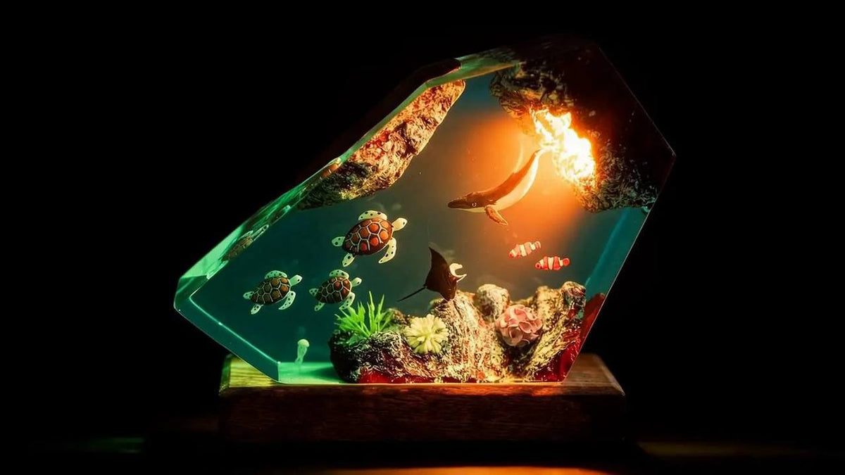 Resin lamp with an underwater scene lit warmly from its base